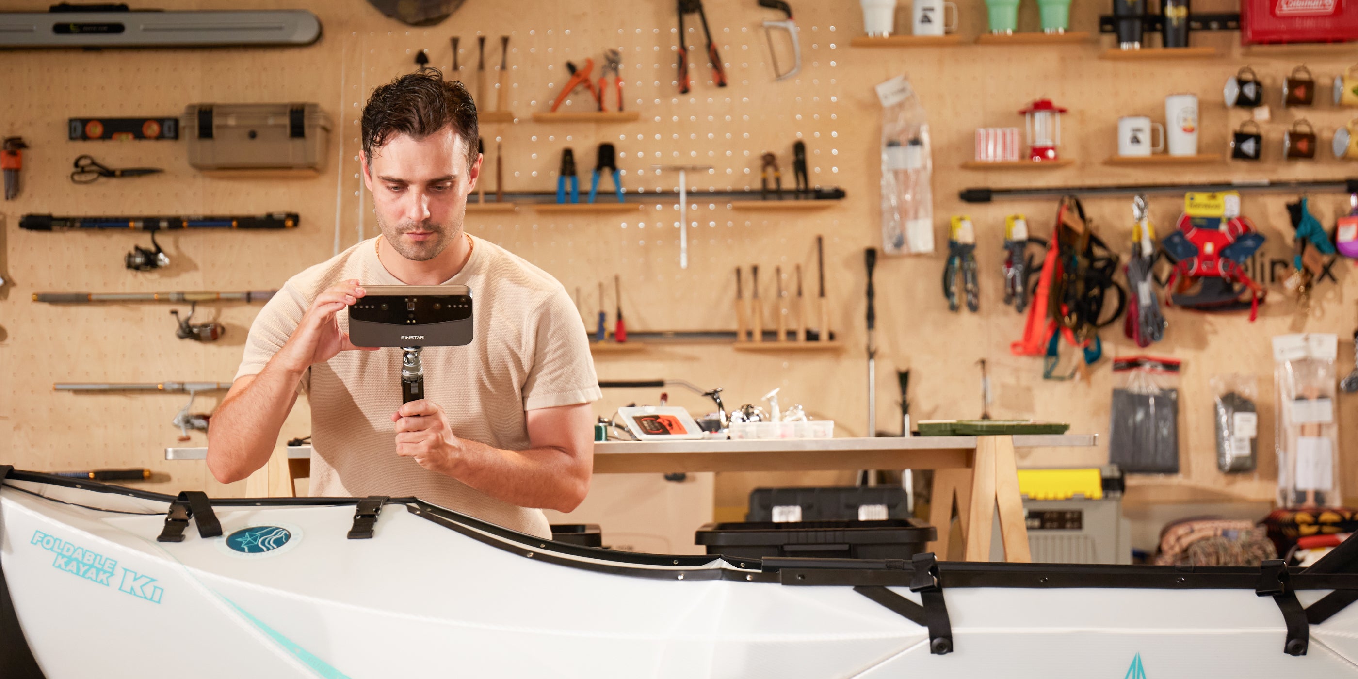 User scanning a kayak with EINSTAR device in a workshop. Highlights 'Comprehensive Object Scanning' and fast mode for larger objects.