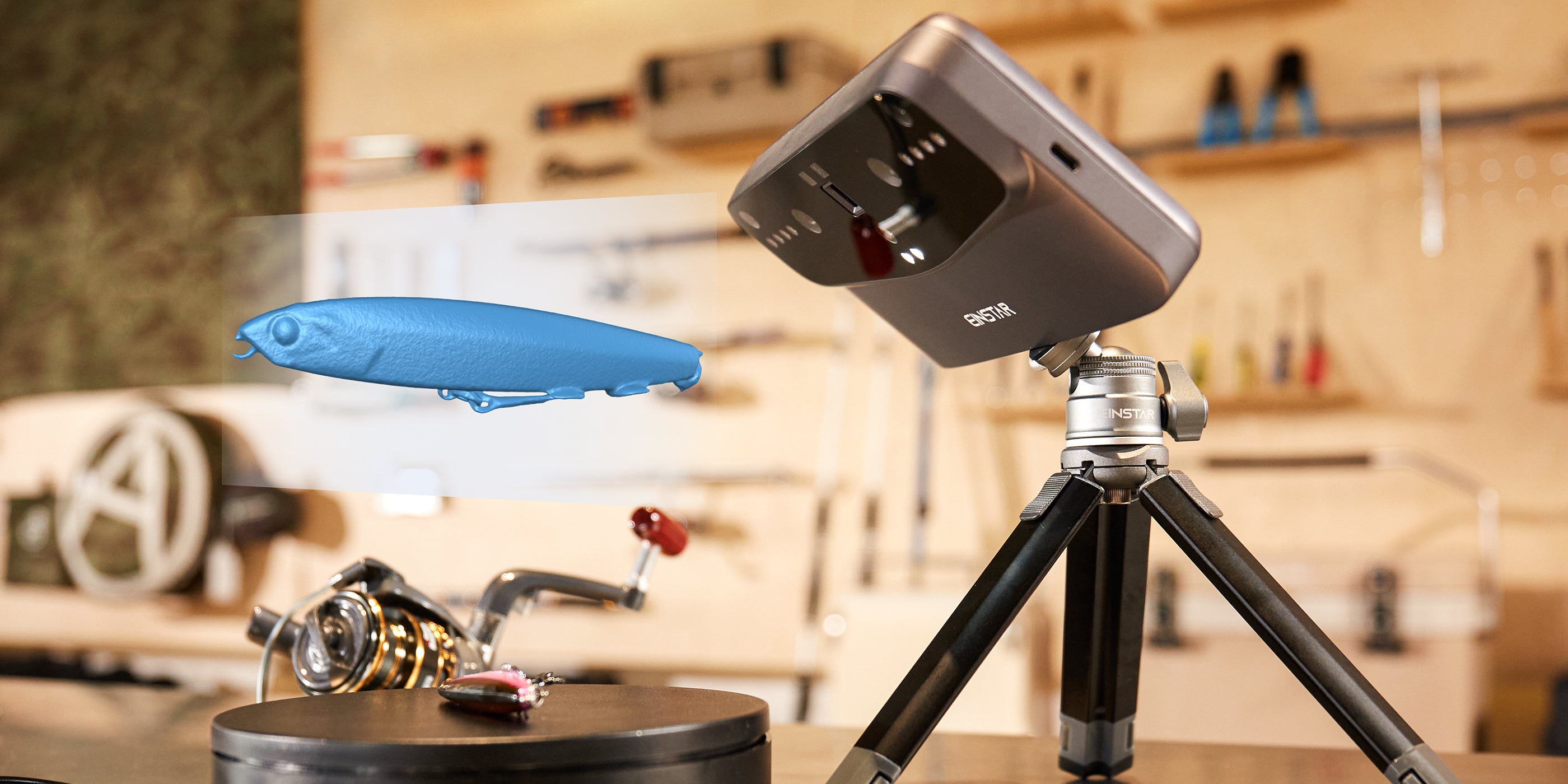 User scanning a fishing lure with EINSTAR device in HD mode, designed for small to medium objects with 100-250mm distance.
